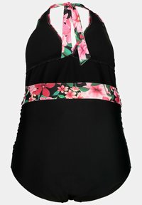 Maillot de bain noir avec un design à col halter, featuring une bande à motif floral en rose et vert. Matériau doux avec des fronces sur les côtés.