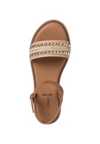 Ruske sandaalit, joissa on leveä punottu hihna kultasävyisillä helmillä. Pehmeä vaahtomuovipohja ja säädettävä nilkkaremmi soljella.