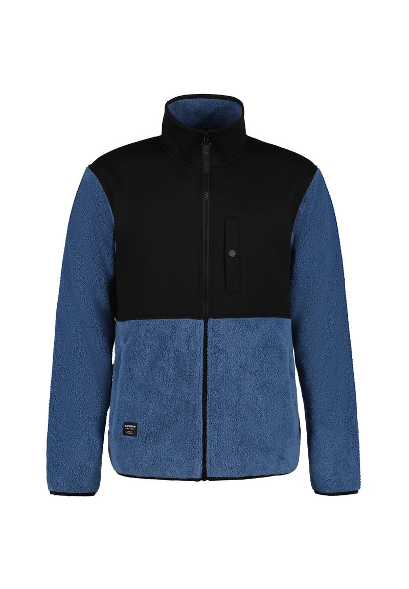 Giacca in fleece con la parte superiore nera, la parte inferiore blu, colletto alto, chiusura frontale con zip e tasca a toppa. Tessuto morbido e strutturato.