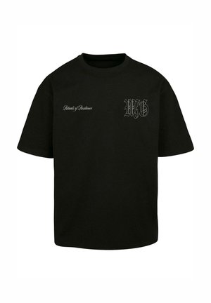 T-shirt in cotone nero con scollatura rotonda e maniche corte, caratterizzata da testo e logo bianchi sul lato sinistro anteriore.
