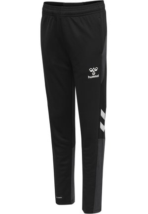 Schwarze Sporthose mit elastischem Bund, ausgestattet mit grauen seitlichen Einsätzen und dem weißen Hummel-Logo. Hergestellt aus einem glatten, atmungsaktiven Material.