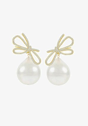 Gold earrings with a bow design embellished with rhinestones, featuring large, glossy white pearl teardrops as pendants.
