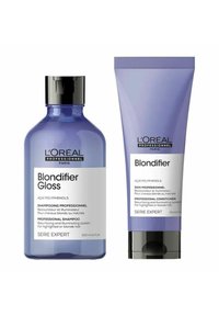 L'Oréal Professionnel Blondifier shampoo and conditioner set. The bottles are purple with black accents and feature clear labels with product details.