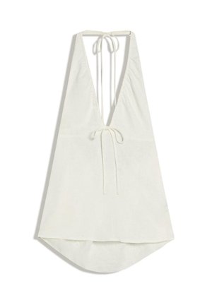 Haut blanc à col licou avec un décolleté en V profond et des liens ajustables au niveau du cou et du dos, coupe ample avec ourlet arrondi.