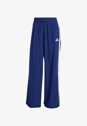 Marineblauwe sportbroek met een brede pijp, elastische tailleband en witte zijstrepen. Bevat een Adidas-logo aan de bovenlinkerkant.