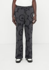 Σκούρο γκρι παντελόνι φανελένιο με μεγάλο λουλούδι σχέδιο, ελαστική μέση με κορδόνι και απλή σχεδίαση ποδιού. Λείο βαμβακερό ύφασμα.