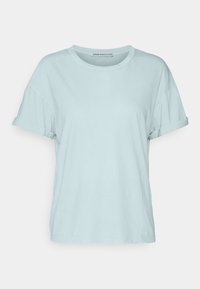 T-shirt in cotone azzurro chiaro con maniche corte arrotolate, scollo rotondo e vestibilità comoda, caratterizzato da un design semplice senza motivi visibili.