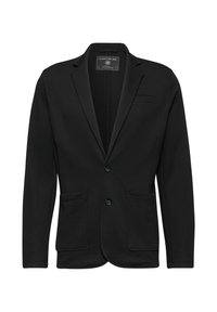 Blazer negro con una tela texturizada, que presenta un cierre frontal de dos botones, solapas con muesca y dos bolsillos frontales. Sin patrón ni acentos visibles.