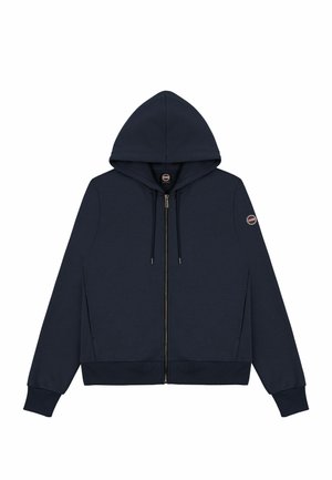 Sudadera con cremallera en color azul marino, con capucha, puños y dobladillo acanalados. Presenta una textura suave y un parche con el logo en la manga izquierda.