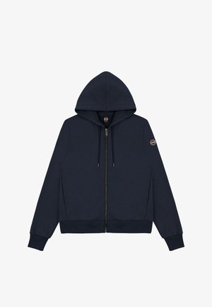 Marineblå zip-up hættetrøje med hætte, ribbede manchetter og kant. Har en glat tekstur og et logopatch på venstre ærme.