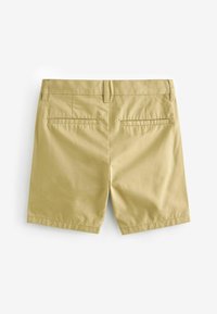 Shorts en coton beige avec une texture lisse, dotés de deux poches arrière et d'une coupe droite, conçus pour un usage décontracté.