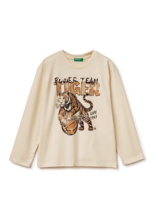 Crèmekleurig longsleeve shirt met een grafische print van een tijger die basketbal speelt, met de tekst "Power Team Tiger" in bruine en zwarte kleuren.