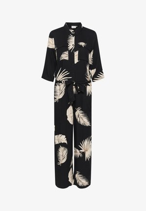 Sort jumpsuit med krèmefarvet palmebladtryk, knaplukning foran, to brystlommer, 3/4-ærmer og et matchende bælte i taljen.