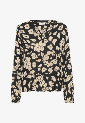 Blouse noire à manches longues avec un motif floral beige, décolleté en V, en tissu doux, coupe décontractée et poignets froncés.