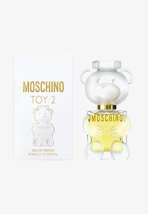 Moschino Toy 2 Eau de Parfum with 50ml bottle shaped like a clear teddy bear holding yellow perfume, beside white box with gold lettering.