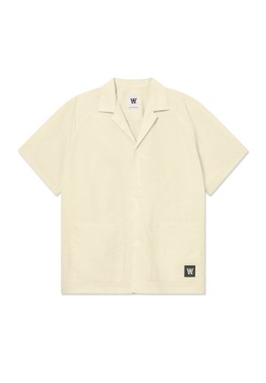 Short-sleeve, light beige shirt made from a soft fabric. Features a spread collar, front buttons, and two front pockets. Logo on lower corner.