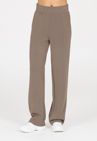 Lightweight, brown wide-leg pants with an elastic waistband. Made of soft fabric, featuring a smooth texture and a relaxed fit. Casual styling.