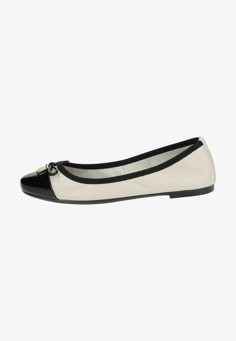 Ballet flat shoe featuring a black patent toe cap, cream leather upper, elasticized black trim, and a decorative bow with emblem.