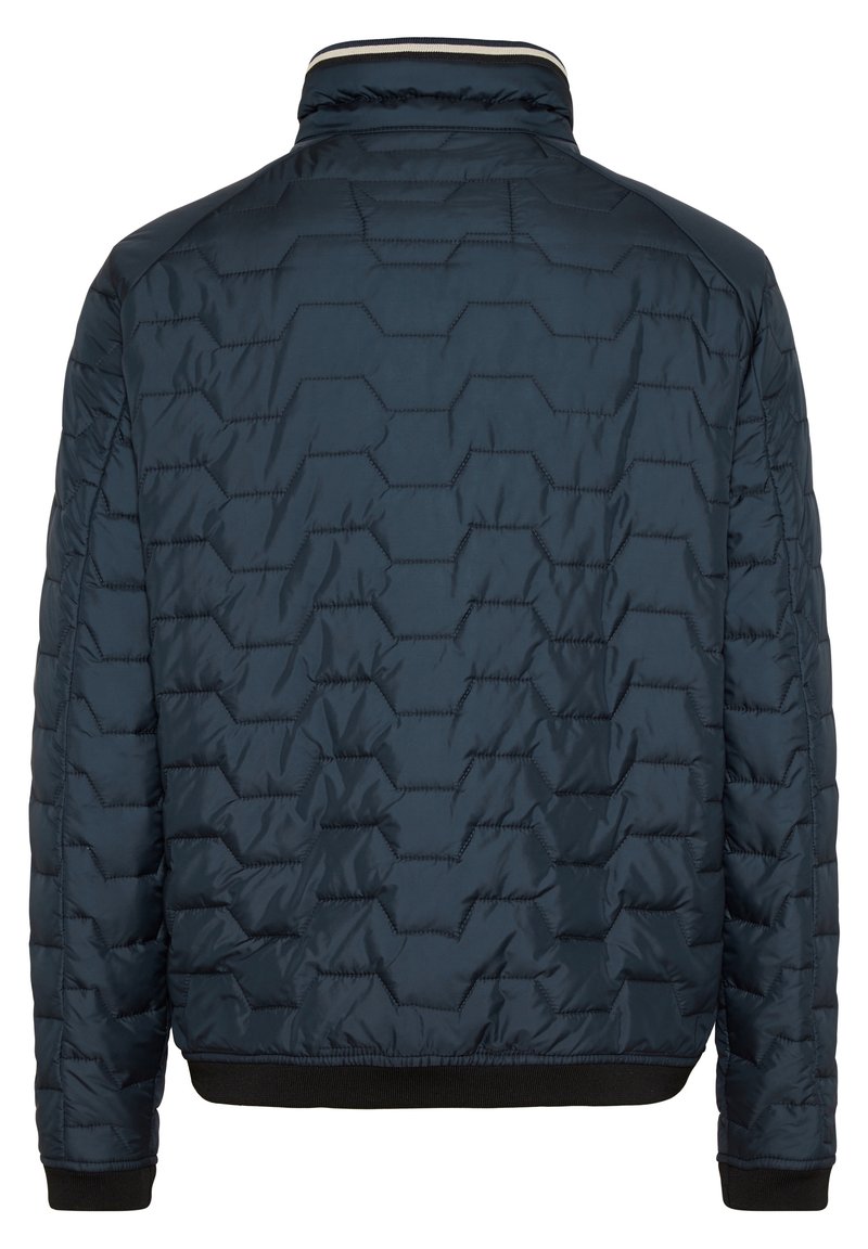 Veste matelassée bleu marine avec motif de couture géométrique, poignets élastiques et ourlet, et un col haut, vue de dos.