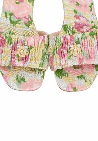 Pink and green floral patterned sandals with a metallic sheen, featuring ruffled straps and a decorative bee embellishment.