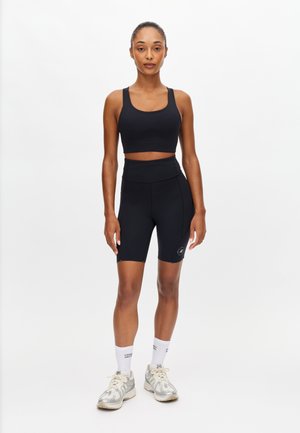 - Krótkie legginsy do biegania