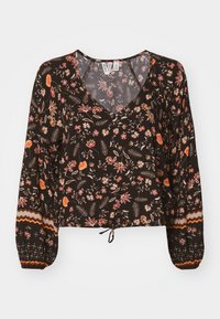 Blouse noire à motifs floraux avec un décolleté en V, de longues manches bouffantes, un ourlet à cordon et des motifs complexes en orange, rose et vert. Tissu doux.