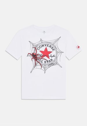 White cotton t-shirt featuring a red star logo, spider graphic, and web design. Black outlines and text, short sleeves, crew neck.