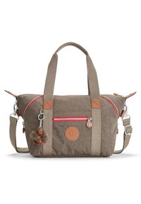 Beige canvas bag with red zip, leather accents, dual handles, detachable strap, and a keychain monkey charm. Circular logo on front.