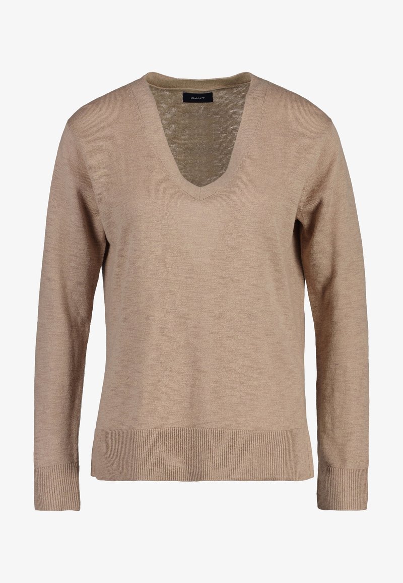 Beiger V-Ausschnitt-Pullover aus weichem Stoff. Lange Ärmel mit gerippten Bündchen und Saum. Glatte Struktur mit entspanntem Schnitt. Markenlabel: GANT.