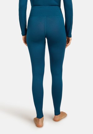 Teal leggings med hög midja, tillverkade av ett mjukt, stretchigt material. Har en enfärgad design utan synliga mönster eller detaljer.
