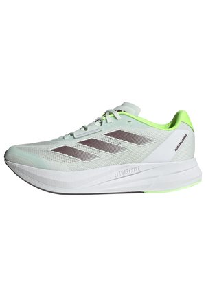 Zapatillas de running ligeras con una parte superior de malla verde menta, rayas plateadas reflectantes y una suela blanca acolchada con acentos en verde neón.