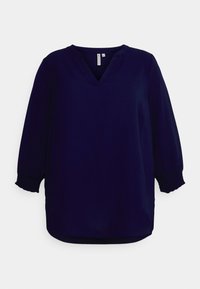 Blusa blu navy con scollo a V e maniche a tre quarti. Le maniche presentano polsini elasticizzati e hanno una forma leggermente drappeggiata.