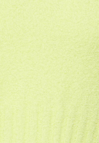 Tecido de malha amarelo brilhante com uma textura suave, apresentando um padrão canelado nas bordas para um detalhe e dimensão adicionais.