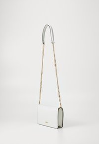 White leather shoulder bag with black edges, rectangular shape, gold chain strap, and smooth texture. Features a subtle logo on the front.