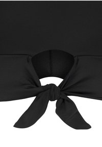 Black fabric top featuring a knotted tie detail at the waist and a circular cut-out. The material has a smooth texture with a fitted design.