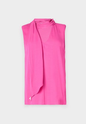 Sleeveless top in bright pink, featuring a soft draped neckline and a subtle ribbon detail at the hem. Made of smooth, lightweight fabric.