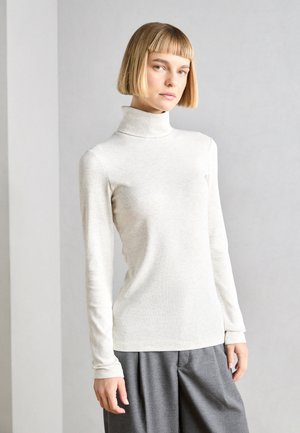 Light grey turtleneck top made of soft fabric, featuring long sleeves and a fitted design, paired with wide grey trousers.
