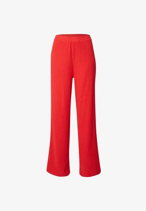 Wijdere broek in helder rood. Gemaakt van een gestructureerde stof met een elastische tailleband. Kenmerkt zich door een ontspannen pasvorm en een volle lengte.
