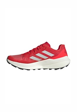Red athletic shoe with mesh upper, three white stripes on the side, padded collar, light-colored midsole, and black outsole with treads.
