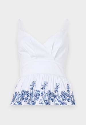 Top din bumbac alb, cu decolteu în V, bretele ajustabile și un tiv evazat decorat cu broderie florală albastră pe margine.