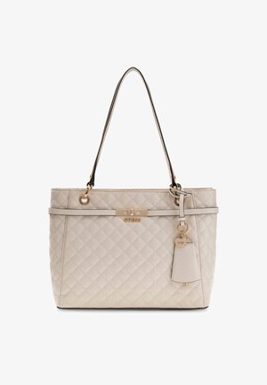 Beige steppelt táska arany színű fémrészekkel, logóval ellátott táblával és charm-mal. Két válltáska a hordozáshoz. Puha tapintású.