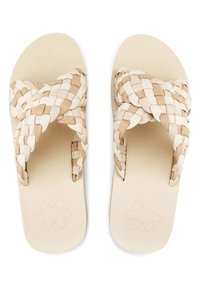 Woven beige sandals with cross straps, made of synthetic material, featuring a textured sole and a floral design on the footbed.