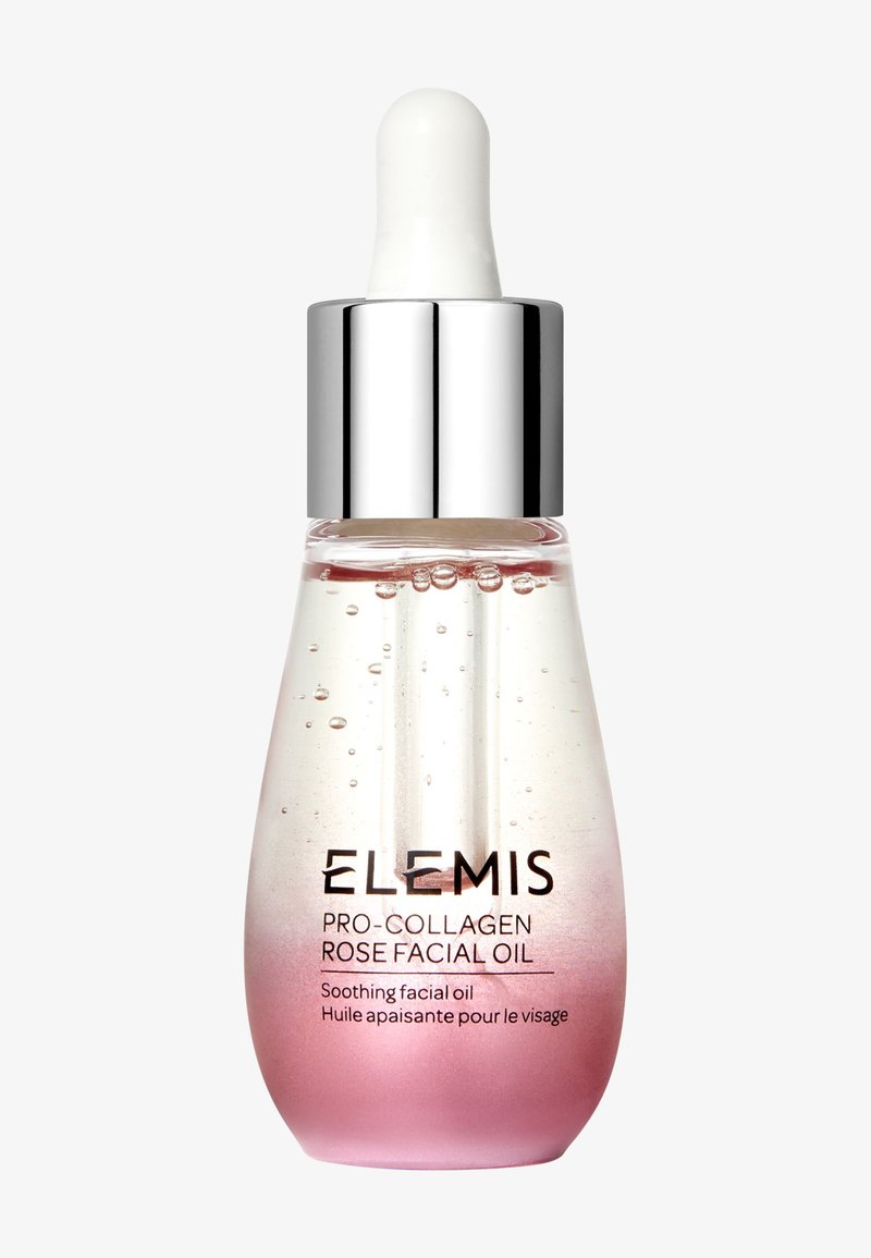 Flacon compte-gouttes en verre transparent avec bouchon argenté contenant l’huile visage Pro-Collagen Rose d’Elemis avec un dégradé du rose au transparent et des bulles visibles.
