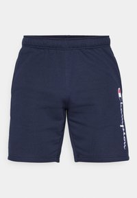Pantalones cortos atléticos de algodón azul marino con una cinturilla elástica y un acento del logo "Champion" en blanco en la pierna izquierda. Textura suave con dobladillo cosido.
