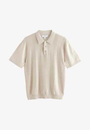 Polo shirt beige a maniche corte con texture a costine, abbottonatura a tre bottoni e colletto lavorato a maglia. Presenta righe verticali per un tocco di dettaglio.
