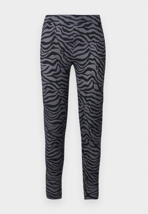 Tight-fitting leggings in black and gray with a zebra stripe pattern. Made from a smooth, stretchy fabric. Full-length design.
