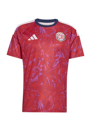 Red short-sleeve soccer jersey featuring a wavy pattern in darker red and violet tones, with white Adidas stripes and a crest logo.