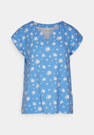 Blusa azul com decote em V e mangas curtas tipo morcego. Apresenta um padrão floral branco. Feita de um tecido macio com um corte descontraído.