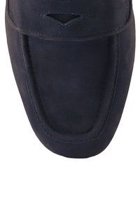 Suede loafers in navy blue with a sleek design. Features a rounded toe and subtle stitching. Notable cutout detail on the vamp.