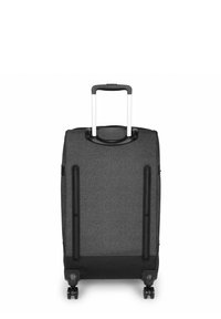 Rollkoffer aus dunkelgrauem Stoff mit schwarzen Hartplastik-Akzenten. Verfügt über einen ausziehbaren Griff, integrierte Rollen und seitliche Griffe.